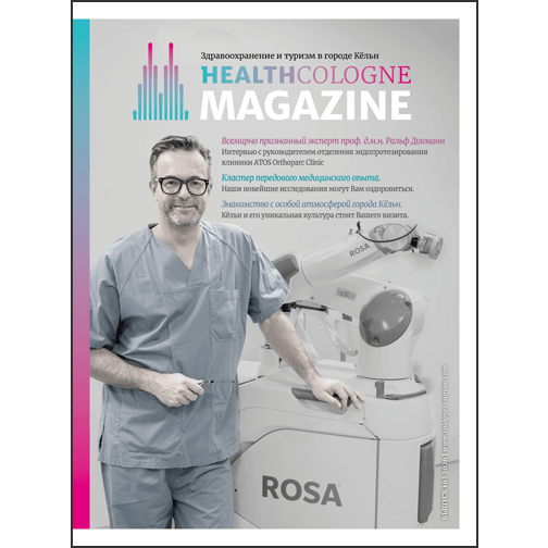 Auf dem Cover ist ein freundlich lächelnder Arzt zu sehen, der neben einem medizinischen Gerät steht.