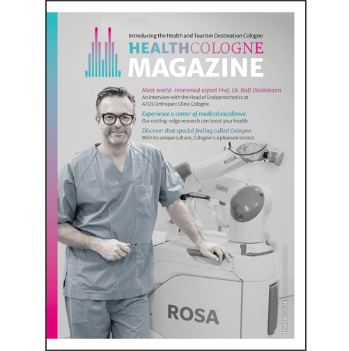 Auf dem Cover ist ein freundlich lächelnder Arzt zu sehen, der neben einem medizinischen Gerät steht.