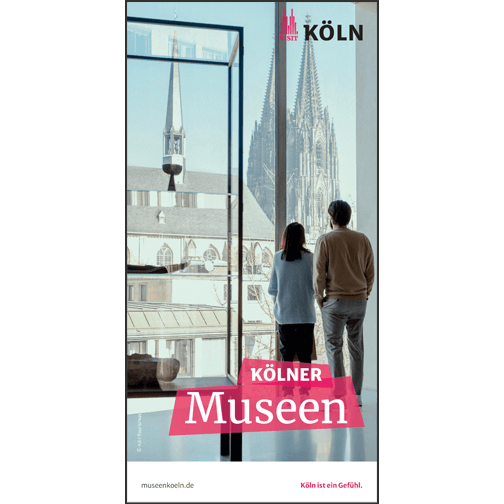 Auf dem Cover sind zwei Personen abgebildet, die vor einem Panoramafenster stehen mit Blick auf den Kölner Dom.